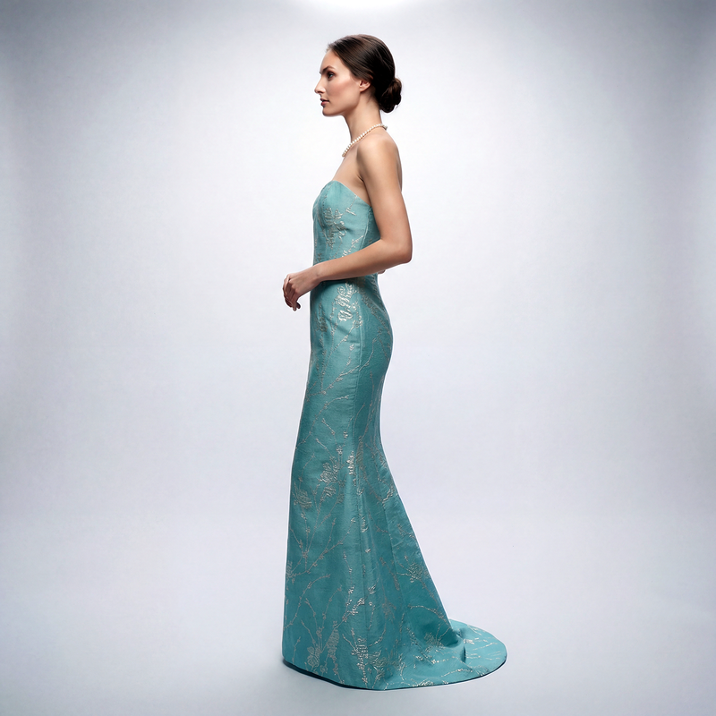 Shop our NYC-made Aqua Blue Brocade Trumpet Gown.